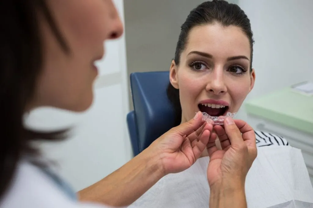 Clear aligner being fitted for a patient at Larson Orthodontics