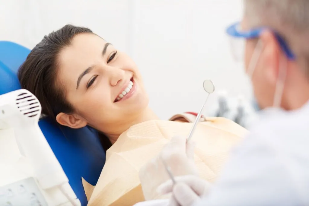 Patient with her orthodontist during an exam in Riverside, CA