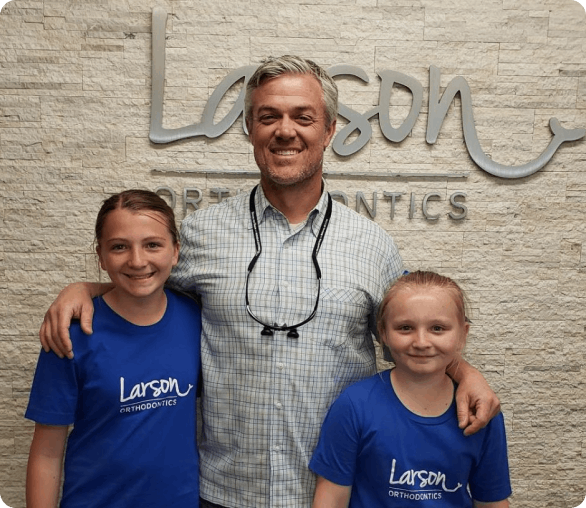 Orthodontist with two young patients at Larson Orthodontics in Riverside, CA