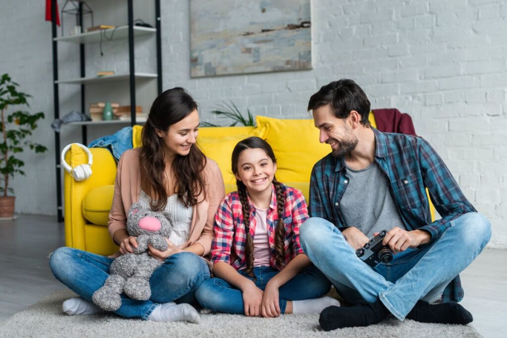 Parents with their daughter discussing the best age for braces